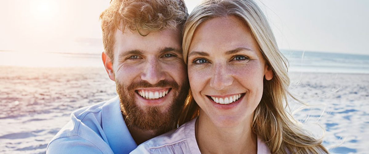 portrait-of-happy-couple-on-the-beach-2024-09-17-11-49-03-utc